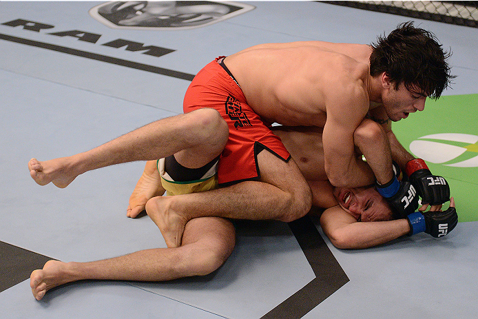LACHUTE, CANADA - NOVEMBER 5: (L-R) Team Canada fighter Elias Theodorou controls the body of Team Australia fighter Zein Saliba in their middleweight bout during filming of The Ultimate Fighter Nations television series on November 5, 2013 in Lachute, Qu