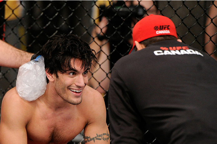 LACHUTE, CANADA - NOVEMBER 5: Team Canada fighter Elias Theodorou smiles in between rounds during his middleweight bout against Team Australia fighter Zein Saliba during filming of The Ultimate Fighter Nations television series on November 5, 2013 in Lac