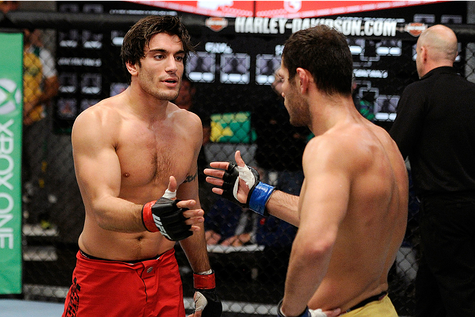 LACHUTE, CANADA - NOVEMBER 5: (L-R) Team Canada fighter Elias Theodorou is congratulated by Team Australia fighter Zein Saliba after Elias defeated Zein by decision during filming of The Ultimate Fighter Nations television series on November 5, 2013 in L