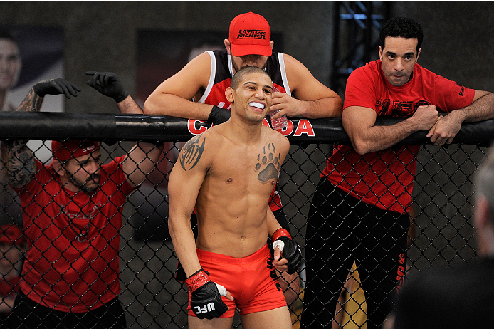 LACHUTE, CANADA - NOVEMBER 2: Team Canada fighter Kajan Johnson smiles in the Octagon before taking on Team Australia fighter Brendan O'Reilly in their welterweight bout during filming of The Ultimate Fighter Nations television series on November 2, 2013