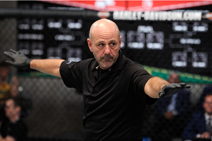 LACHUTE, CANADA - NOVEMBER 2: Referee Yves Lavigne introduces Team Australia fighter Brendan O'Reilly takes on Team Canada fighter Kajan Johnson before their welterweight bout during filming of The Ultimate Fighter Nations television series on November 2