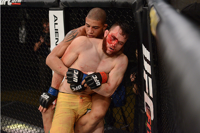 LACHUTE, CANADA - NOVEMBER 2: Team Australia fighter Brendan O'Reilly (R) takes on Team Canada fighter Kajan Johnson (L) in their welterweight bout during filming of The Ultimate Fighter Nations television series on November 2, 2013 in Lachute, Quebec, C