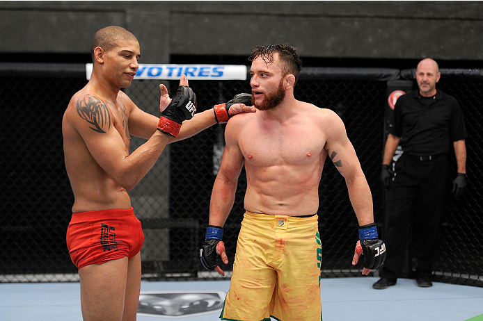 LACHUTE, CANADA - NOVEMBER 2: Team Canada fighter Kajan Johnson (L) is congratulated by Team Australia fighter Brendan O'Reilly (R) after O'Reilly was submitted by Kajan Johnson by submission in their welterweight bout during filming of The Ultimate Figh