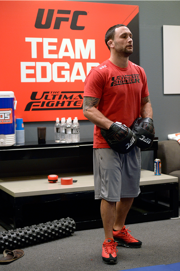 LAS VEGAS, NV - OCTOBER 24: Coach Frankie Edgar trains his fighter Hector Urbina before facing Team Penn fighter Cathal Pendred in their preliminary fight during filming of season nineteen of The Ultimate Fighter on October 24, 2013 in Las Vegas, Nevada.