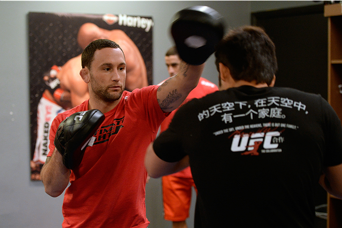 LAS VEGAS, NV - OCTOBER 24: (L-R) Coach Frankie Edgar trains his fighter Hector Urbina before facing Team Penn fighter Cathal Pendred in their preliminary fight during filming of season nineteen of The Ultimate Fighter on October 24, 2013 in Las Vegas, N