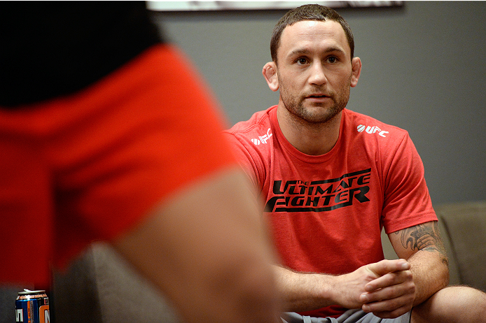 LAS VEGAS, NV - OCTOBER 24: Coach Frankie Edgar instructs his fighter Hector Urbina before facing Team Penn fighter Cathal Pendred in their preliminary fight during filming of season nineteen of The Ultimate Fighter on October 24, 2013 in Las Vegas, Neva