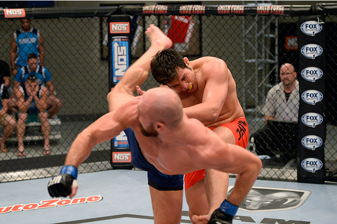 LAS VEGAS, NV - OCTOBER 24: (L-R) Team Penn fighter Cathal Pendred kicks Team Edgar fighter Hector Urbina in their preliminary fight during filming of season nineteen of The Ultimate Fighter on October 24, 2013 in Las Vegas, Nevada. (Photo by Jeff Bottar
