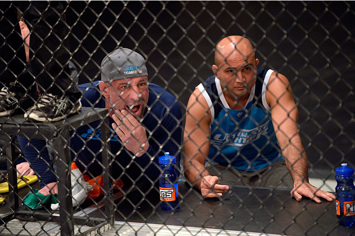 LAS VEGAS, NV - OCTOBER 24: (R-L) Coach BJ Penn and wrestling coach Mark Coleman yell strategy to Team Penn fighter Cathal Pendred during his matchup against Team Edgar fighter Hector Urbina in their preliminary fight during filming of season nineteen of