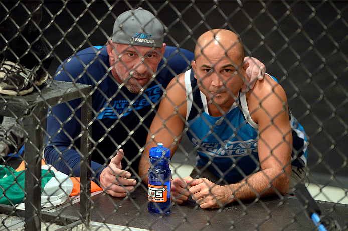 LAS VEGAS, NV - OCTOBER 24: (R-L) Coach BJ Penn and wrestling coach Mark Coleman yell strategy to Team Penn fighter Cathal Pendred during his matchup against Team Edgar fighter Hector Urbina in their preliminary fight during filming of season nineteen of