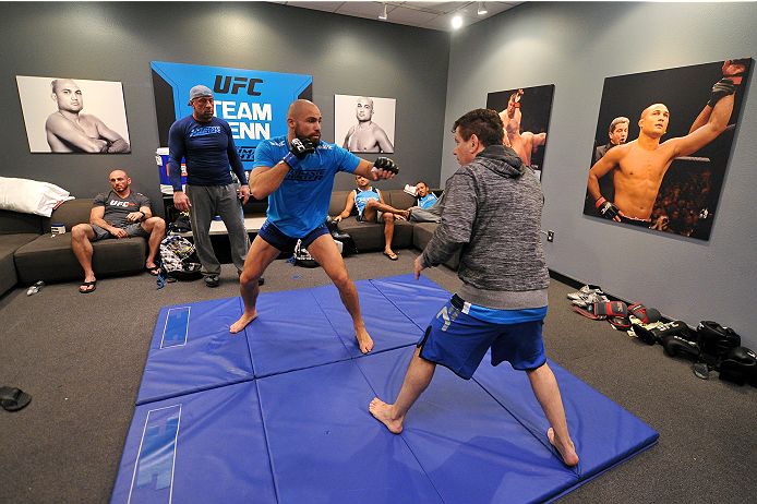 LAS VEGAS, NV - OCTOBER 24: (L-R) Team Penn fighter Cathal Pendred warms up with jiu jitsu coach Andre Pederneiras before facing Team Edgar fighter Hector Urbina in their preliminary fight during filming of season nineteen of The Ultimate Fighter on Octo