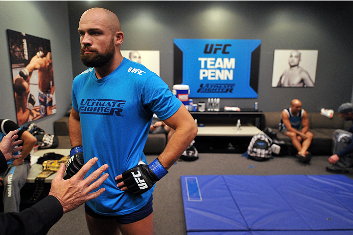 LAS VEGAS, NV - OCTOBER 24: Team Penn fighter Cathal Pendred receives instructions from the official before facing Team Edgar fighter Hector Urbina in their preliminary fight during filming of season nineteen of The Ultimate Fighter on October 24, 2013 i