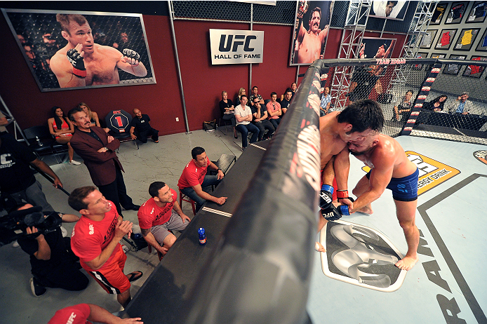 LAS VEGAS, NV - OCTOBER 24: (R-L) Team Penn fighter Cathal Pendred controls the body of Team Edgar fighter Hector Urbina in their preliminary fight during filming of season nineteen of The Ultimate Fighter on October 24, 2013 in Las Vegas, Nevada. (Photo