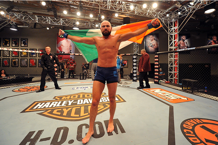 LAS VEGAS, NV - OCTOBER 24: Team Penn fighter Cathal Pendred celebrates after defeating Team Edgar fighter Hector Urbina in their preliminary fight during filming of season nineteen of The Ultimate Fighter on October 24, 2013 in Las Vegas, Nevada. (Photo