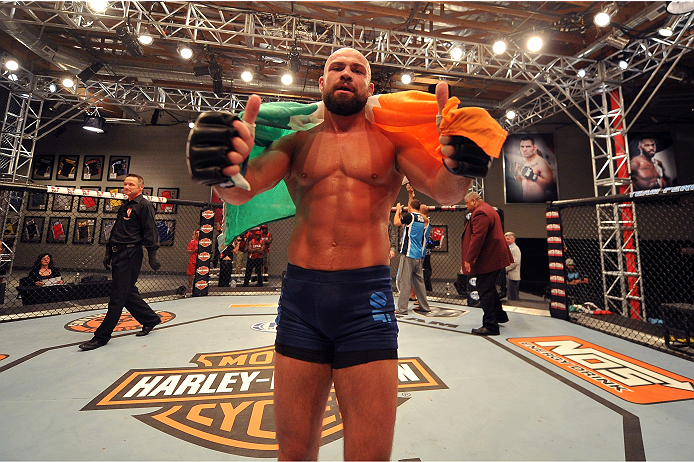 LAS VEGAS, NV - OCTOBER 24: Team Penn fighter Cathal Pendred celebrates after defeating Team Edgar fighter Hector Urbina in their preliminary fight during filming of season nineteen of The Ultimate Fighter on October 24, 2013 in Las Vegas, Nevada. (Photo