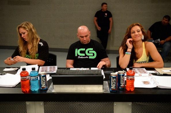 LAS VEGAS, NV - MAY 29: (L-R) Coach Ronda Rousey, UFC President Dana White and coach Miesha Tate analyze fighters during filming of season eighteen of The Ultimate Fighter on May 29, 2013 in Las Vegas, Nevada. (Photo by Al Powers/Zuffa LLC/Zuffa LLC via