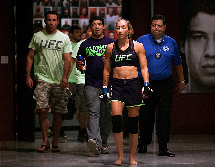 LAS VEGAS, NV - JULY 18: Team Melendez fighter Heather Jo Clark prepares to enter the Octagon before facing team Pettis fighter Felice Herrig during filming of season twenty of The Ultimate Fighter on July 18, 2014 in Las Vegas, Nevada. (Photo by Brandon