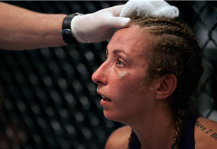 LAS VEGAS, NV - JULY 18: Team Melendez fighter Heather Jo Clark receives advice in between rounds while facing team Pettis fighter Felice Herrig during filming of season twenty of The Ultimate Fighter on July 18, 2014 in Las Vegas, Nevada. (Photo by Bran