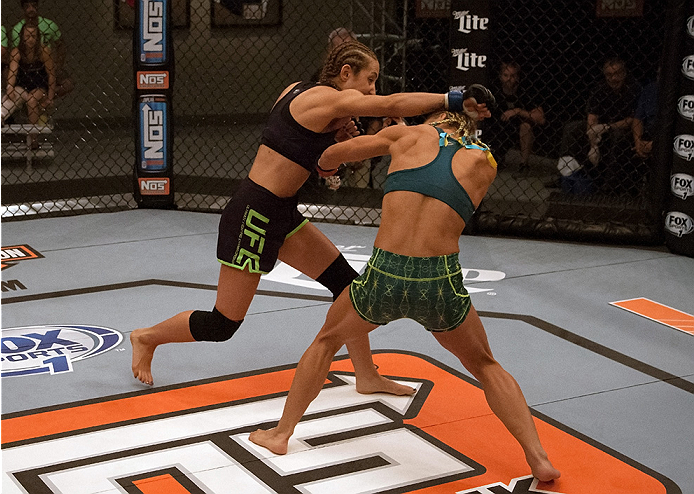 LAS VEGAS, NV - JULY 18: (L-R) Team Melendez fighter Heather Jo Clark punches team Pettis fighter Felice Herrig during filming of season twenty of The Ultimate Fighter on July 18, 2014 in Las Vegas, Nevada. (Photo by Brandon Magnus/Zuffa LLC/Zuffa LLC vi