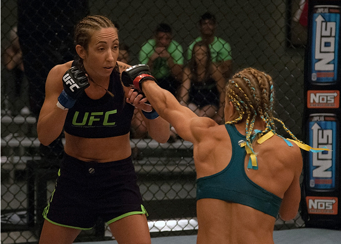 LAS VEGAS, NV - JULY 18: (R-L) Team Pettis fighter Felice Herrig throws a punch at team Melendez fighter Heather Jo Clark during filming of season twenty of The Ultimate Fighter on July 18, 2014 in Las Vegas, Nevada. (Photo by Brandon Magnus/Zuffa LLC/Zu