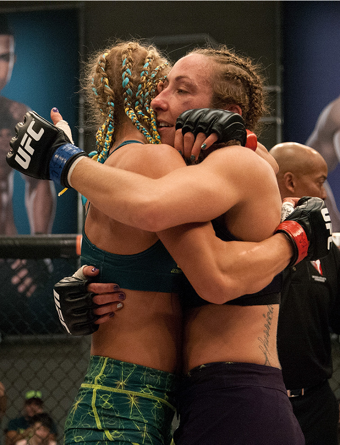 LAS VEGAS, NV - JULY 18: Team Pettis fighter Felice Herrig hugs team Melendez fighter Heather Jo Clark after their fight during filming of season twenty of The Ultimate Fighter on July 18, 2014 in Las Vegas, Nevada. (Photo by Brandon Magnus/Zuffa LLC/Zuf