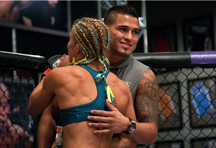 LAS VEGAS, NV - JULY 18: Team Pettis fighter Felice Herrig hugs Head Coach Anthony Pettis after her submission victory over team Melendez fighter Heather Jo Clark during filming of season twenty of The Ultimate Fighter on July 18, 2014 in Las Vegas, Neva