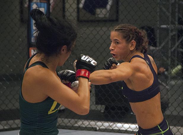 LAS VEGAS, NV - JULY 8: Team Melendez fighter Tecia Torres punches team Pettis fighter Randa Markos during filming of season twenty of The Ultimate Fighter on July 8, 2014 in Las Vegas, Nevada. (Photo by Brandon Magnus/Zuffa LLC/Zuffa LLC via Getty Image