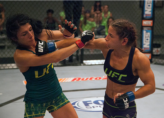 LAS VEGAS, NV - JULY 8: Team Melendez fighter Tecia Torres punches team Pettis fighter Randa Markos during filming of season twenty of The Ultimate Fighter on July 8, 2014 in Las Vegas, Nevada. (Photo by Brandon Magnus/Zuffa LLC/Zuffa LLC via Getty Image