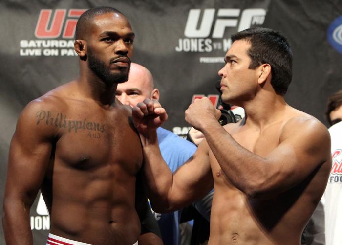 TORONTO, ON - DECEMBER 09: (L-R) UFC Light Heavyweight Champion Jon "Bones" Jones and challenger Lyoto Machida face off after weighing in during the UFC 140 Official Weigh-in at the Air Canada Centre on December 9, 2011 in Toronto, Canada. (Photo by Jos