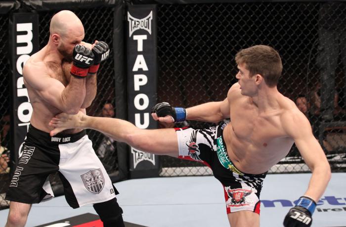 LAS VEGAS, NV - FEBRUARY 04: Stephen Thompson (right) kicks Dan Stittgen during the UFC 143 event at Mandalay Bay Events Center on February 4, 2012 in Las Vegas, Nevada. (Photo by Nick Laham/Zuffa LLC/Zuffa LLC via Getty Images) *** Local Caption *** St