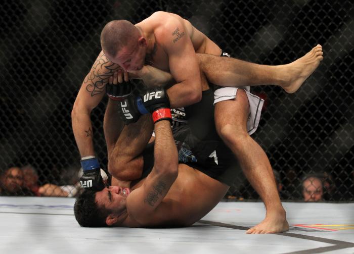 LAS VEGAS, NV - FEBRUARY 04: Michael Kuiper (top) punches Rafael Natal during the UFC 143 event at Mandalay Bay Events Center on February 4, 2012 in Las Vegas, Nevada. (Photo by Josh Hedges/Zuffa LLC/Zuffa LLC via Getty Images) *** Local Caption *** Mic