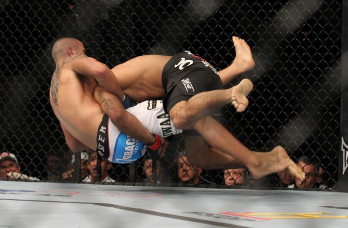 LAS VEGAS, NV - FEBRUARY 04: Rafael Natal (black shorts) takes down Michael Kuiper during the UFC 143 event at Mandalay Bay Events Center on February 4, 2012 in Las Vegas, Nevada. (Photo by Josh Hedges/Zuffa LLC/Zuffa LLC via Getty Images) *** Local Cap