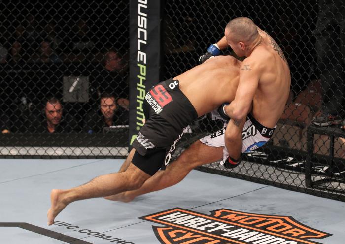 LAS VEGAS, NV - FEBRUARY 04: Rafael Natal (black shorts) takes Michael Kuiper down to the canvas during the UFC 143 event at Mandalay Bay Events Center on February 4, 2012 in Las Vegas, Nevada. (Photo by Nick Laham/Zuffa LLC/Zuffa LLC via Getty Images)