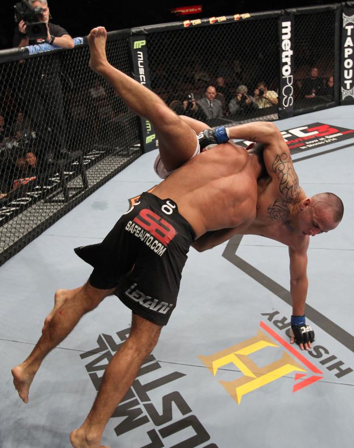 LAS VEGAS, NV - FEBRUARY 04: Rafael Natal (black shorts) slams Michael Kuiper down to the canvas during the UFC 143 event at Mandalay Bay Events Center on February 4, 2012 in Las Vegas, Nevada. (Photo by Nick Laham/Zuffa LLC/Zuffa LLC via Getty Images)