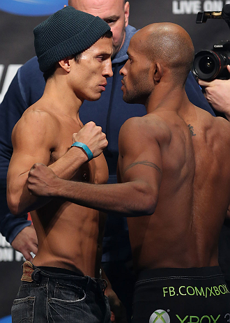 TORONTO, CANADA - SEPTEMBER 21: (L-R) Opponents Joseph Benavidez and Demetrious Johnson face off during the UFC 152 weigh in at Mattamy Athletic Centre at the Gardens on September 21, 2012 in Toronto, Ontario, Canada. (Photo by Josh Hedges/Zuffa LLC/Zuffa