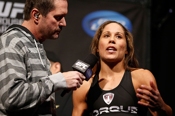 ANAHEIM, CA - FEBRUARY 22: (R-L) Liz Carmouche is interviewed by Mike Goldberg during the UFC 157 weigh-in at Honda Center on February 22, 2013 in Anaheim, California. (Photo by Josh Hedges/Zuffa LLC/Zuffa LLC via Getty Images)
