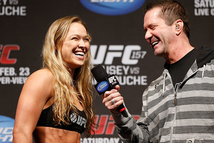 ANAHEIM, CA - FEBRUARY 22: (L-R) Ronda Rousey is interviewed by Mike Goldberg during the UFC 157 weigh-in at Honda Center on February 22, 2013 in Anaheim, California. (Photo by Josh Hedges/Zuffa LLC/Zuffa LLC via Getty Images)