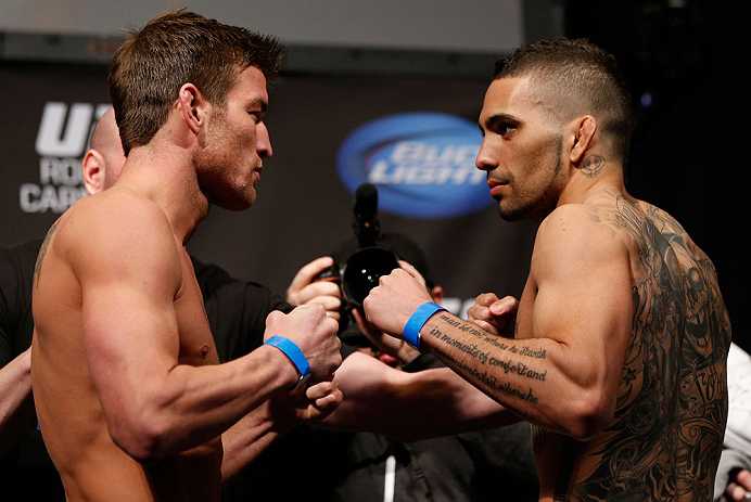 ANAHEIM, CA - FEBRUARY 22: (L-R) Opponents Sam Stout and Caros Fodor face off during the UFC 157 weigh-in at Honda Center on February 22, 2013 in Anaheim, California. (Photo by Josh Hedges/Zuffa LLC/Zuffa LLC via Getty Images)