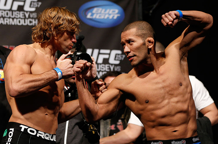 ANAHEIM, CA - FEBRUARY 22: (L-R) Opponents Urijah Faber and Ivan Menjivar face off during the UFC 157 weigh-in at Honda Center on February 22, 2013 in Anaheim, California. (Photo by Josh Hedges/Zuffa LLC/Zuffa LLC via Getty Images)