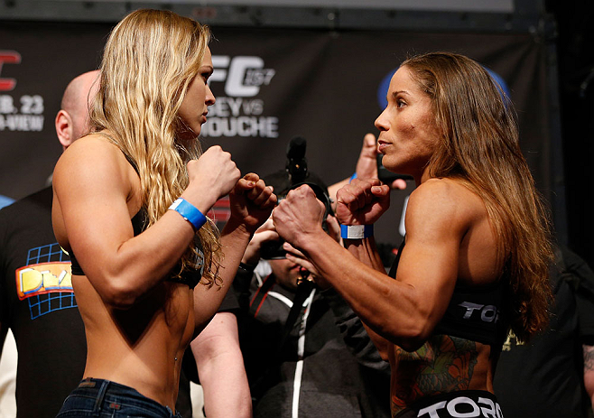 ANAHEIM, CA - FEBRUARY 22: (L-R) Opponents Ronda Rousey and Liz Carmouche face off during the UFC 157 weigh-in at Honda Center on February 22, 2013 in Anaheim, California. (Photo by Josh Hedges/Zuffa LLC/Zuffa LLC via Getty Images)