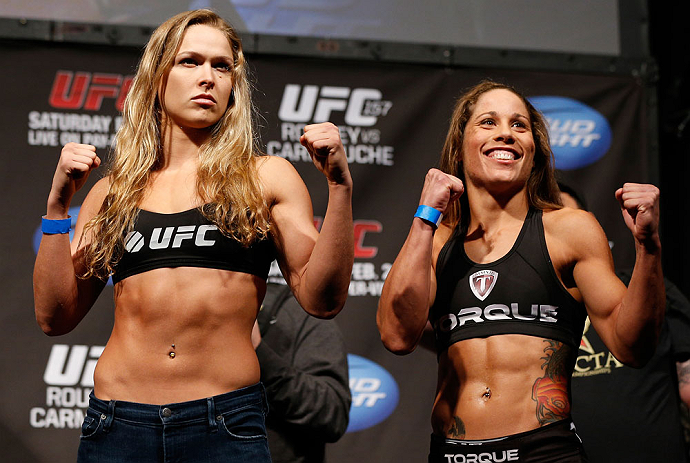 ANAHEIM, CA - FEBRUARY 22: (L-R) Opponents Ronda Rousey and Liz Carmouche pose for photos during the UFC 157 weigh-in at Honda Center on February 22, 2013 in Anaheim, California. (Photo by Josh Hedges/Zuffa LLC/Zuffa LLC via Getty Images)