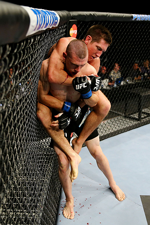 NEWARK, NJ - APRIL 27: Steven Siler (top) battles against Kurt Holobaugh (bottom) in their featherweight bout during the UFC 159 event at the Prudential Center on April 27, 2013 in Newark, New Jersey. (Photo by Al Bello/Zuffa LLC/Zuffa LLC Via Getty Ima