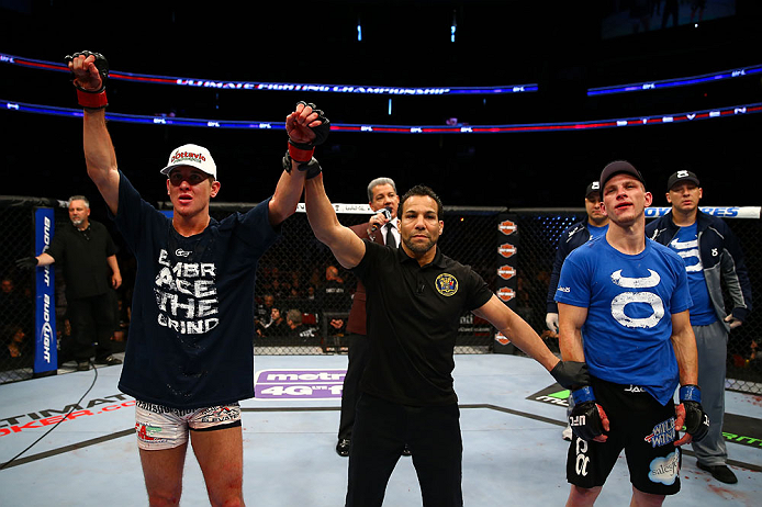 NEWARK, NJ - APRIL 27: Steven Siler (L) is announced winner by unanimous decision in his featherweight bout against Kurt Holobaugh (R) during the UFC 159 event at the Prudential Center on April 27, 2013 in Newark, New Jersey. (Photo by Al Bello/Zuffa LL