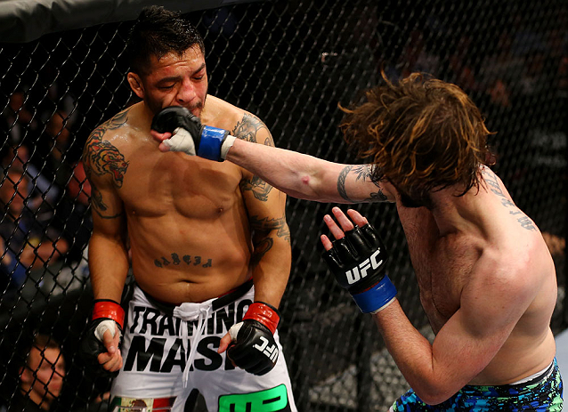 NEWARK, NJ - APRIL 27: Cody McKenzie (R) punches Leonard Garcia (L) in their featherweight bout during the UFC 159 event at the Prudential Center on April 27, 2013 in Newark, New Jersey. (Photo by Al Bello/Zuffa LLC/Zuffa LLC Via Getty Images)