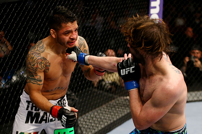 NEWARK, NJ - APRIL 27: Cody McKenzie (R) punches Leonard Garcia (L) in their featherweight bout during the UFC 159 event at the Prudential Center on April 27, 2013 in Newark, New Jersey. (Photo by Al Bello/Zuffa LLC/Zuffa LLC Via Getty Images)