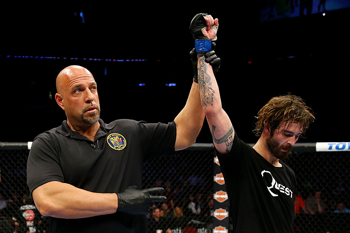 NEWARK, NJ - APRIL 27: Referee Dan Miragliotta announces Cody McKenzie winner by unanimous decision against Leonard Garcia in their featherweight bout during the UFC 159 event at the Prudential Center on April 27, 2013 in Newark, New Jersey. (Photo by Al