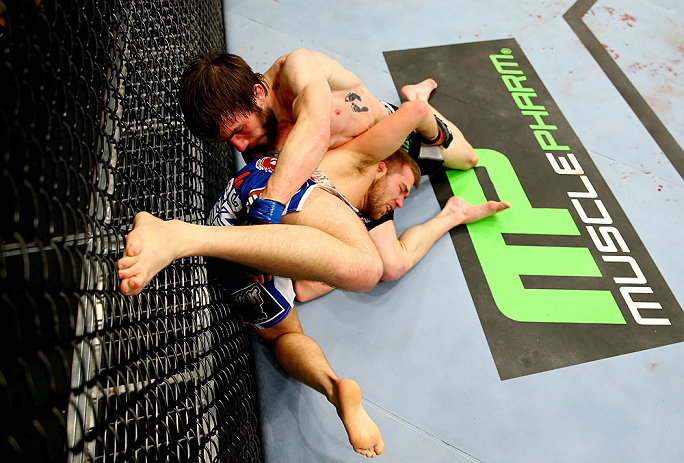 NEWARK, NJ - APRIL 27: Bryan Caraway (R) battles against Johnny Bedford (L) in their bantamweight bout during the UFC 159 event at the Prudential Center on April 27, 2013 in Newark, New Jersey. (Photo by Al Bello/Zuffa LLC/Zuffa LLC Via Getty Images)