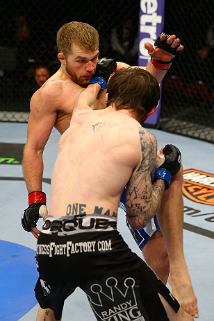 NEWARK, NJ - APRIL 27: Johnny Bedford (R) throws a punch against Bryan Caraway (L) in their bantamweight bout during the UFC 159 event at the Prudential Center on April 27, 2013 in Newark, New Jersey. (Photo by Al Bello/Zuffa LLC/Zuffa LLC Via Getty Ima