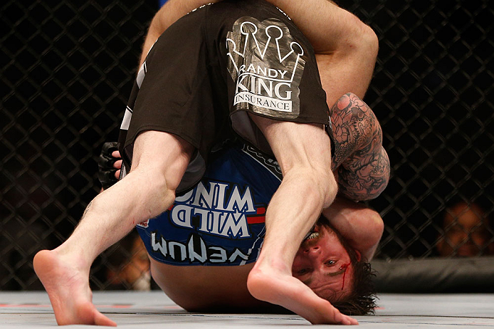 NEWARK, NJ - APRIL 27: Johny Bedford is defeated by Bryan Caraway by submission due to a guillotine choke in their bantamweight fight during the UFC 159 event at the Prudential Center on April 27, 2013 in Newark, New Jersey. (Photo by Josh Hedges/Zuffa