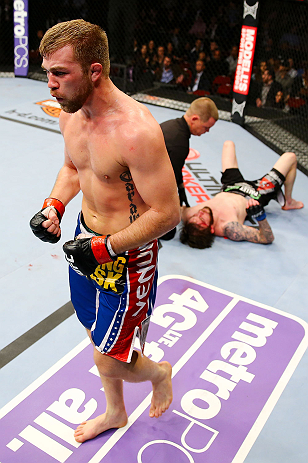 NEWARK, NJ - APRIL 27: Bryan Caraway (L) celebrates winning by submission (guillotine choke) against Johnny Bedford (R) in their bantamweight bout during the UFC 159 event at the Prudential Center on April 27, 2013 in Newark, New Jersey. (Photo by Al Be