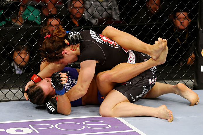 NEWARK, NJ - APRIL 27: Sara McMann (top) battles against Sheila Gaff (bottom) in round one of their women's bantamweight bout during the UFC 159 event at the Prudential Center on April 27, 2013 in Newark, New Jersey. (Photo by Al Bello/Zuffa LLC/Zuffa LL